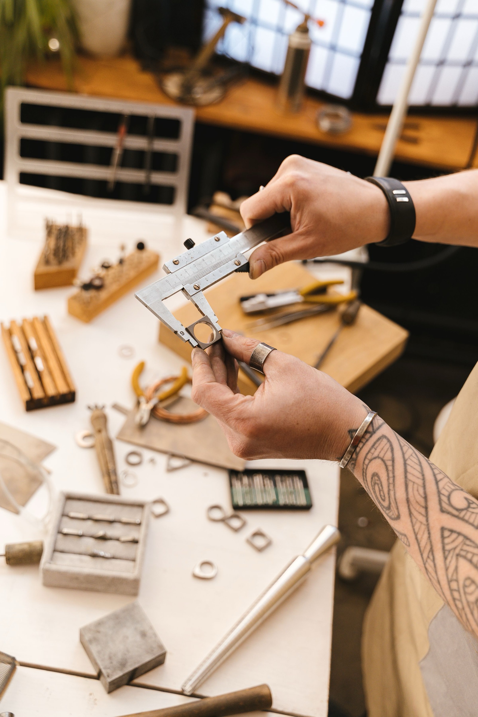 A jeweler setting a stone at the bench